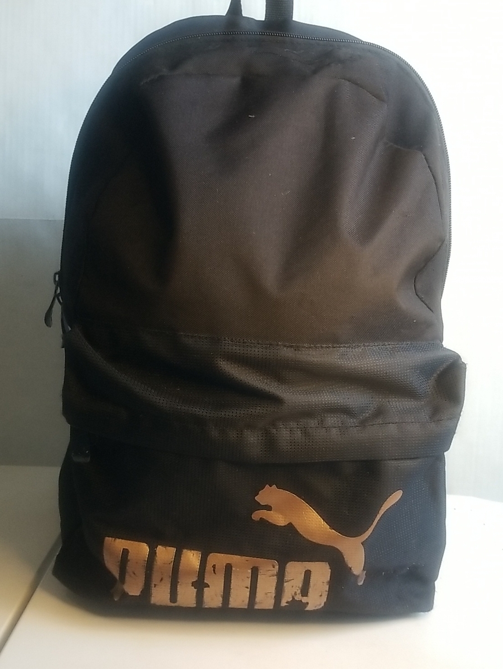 Puma Black Backpack with Gold Logo Accent